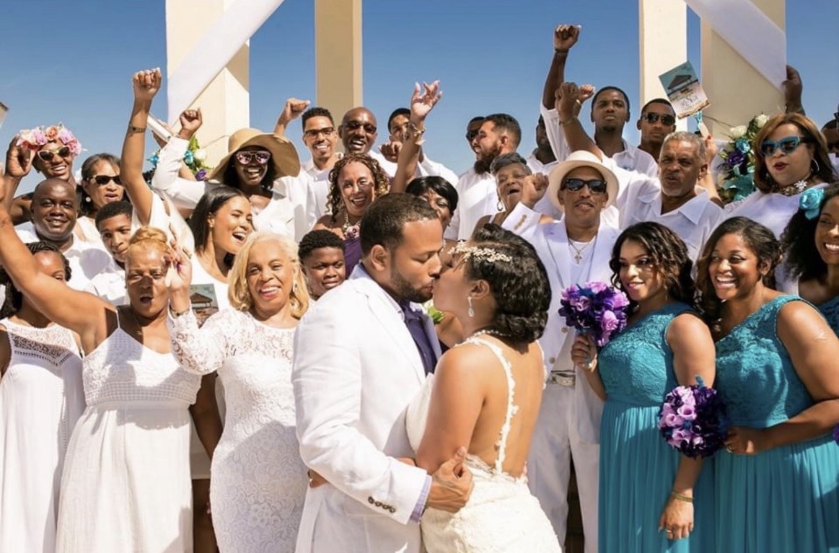 Destination wedding couple overlooking the coast